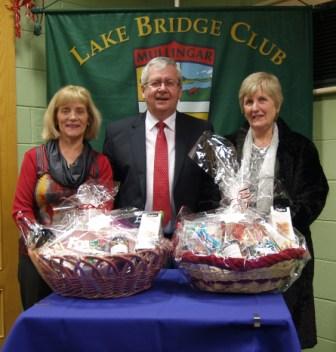 OLake Bridge Club Christmas Hamper - 4th Gross winners Brid Galligan and Monica Harris with Gerry O'Gorman, Club President