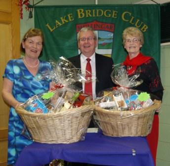 Lake Bridge Club Christmas Hamper Gross winners Susan Tuite and Helen Lynch with Gerry O'Gorman Club President