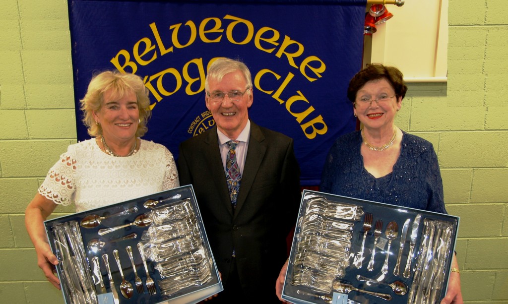 Belvedere Club President Frank Maher, presents his prize to the winners Mary McCormack and Eileen Corrigan.